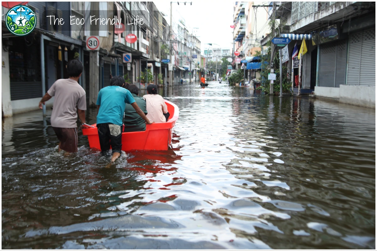 An image showing people on a rescue boat on flooded streets