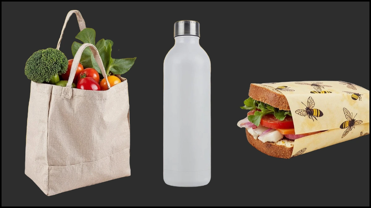 An image of a reusable cloth shopping bag filled with fresh produce, a plain reusable water bottle, and a sandwich in a beeswax wrap